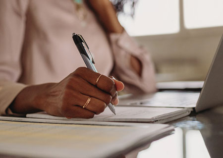 Woman writing on paper
