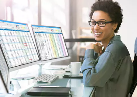 Woman at a computer looking at billing