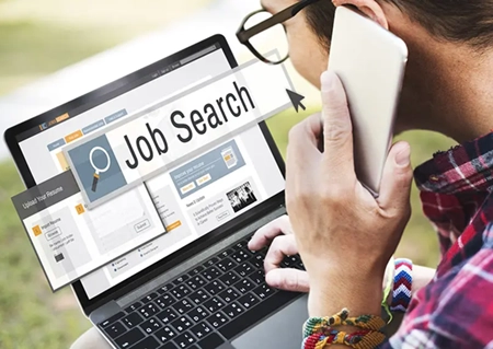 woman on laptop looking for a job